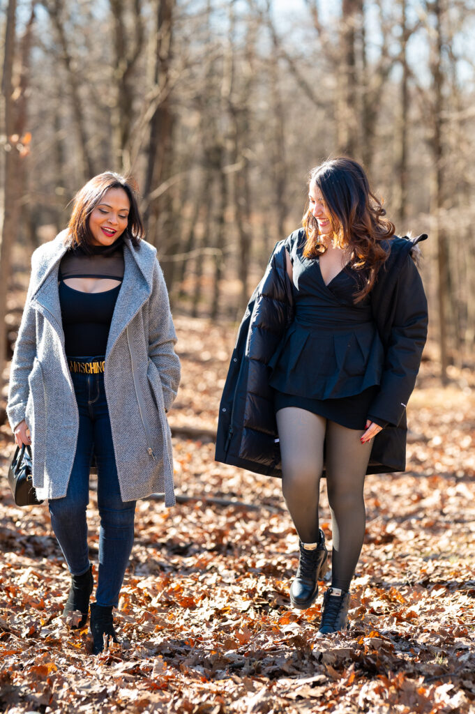 lifestyle portrait of a mother and daughter walking wearing the north face, moschino, gucci